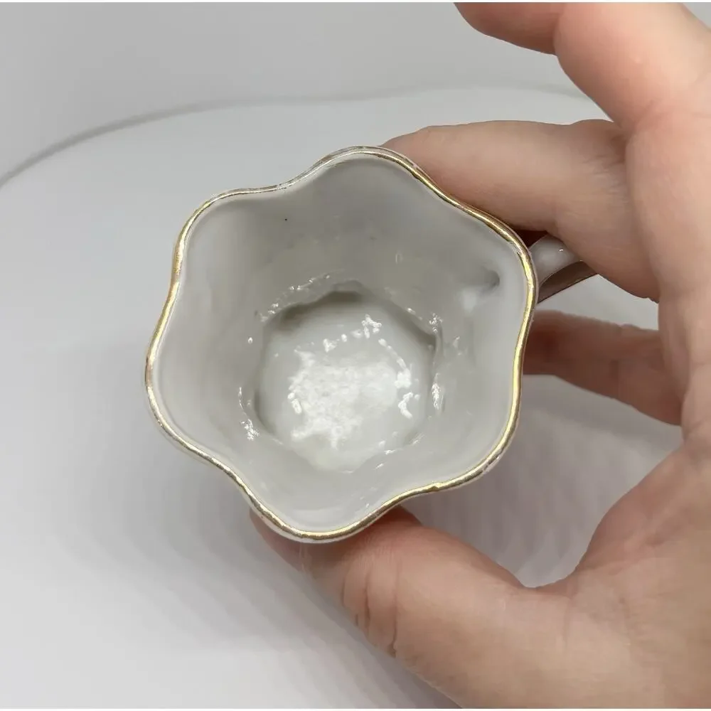 Antique Footed Teacup And Saucer
